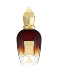 CR Signature Xerjoff Alexandria II Oud Stars perfume bottle with a gold cap and gradient glass against dark smoke