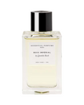 CR Signature Essential Parfums Bois Impérial parfymeflaske med minimalistisk design mot en mørk bakgrunn med støv