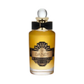 CR Signature Penhaligon's The Dandy Eau de Parfum in a glass bottle with a black bow against a smoky black background.