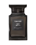 CR Signature Tom Ford Oud Wood Eau de Parfum 100ml in a dark glass bottle against a dramatic smoky black background